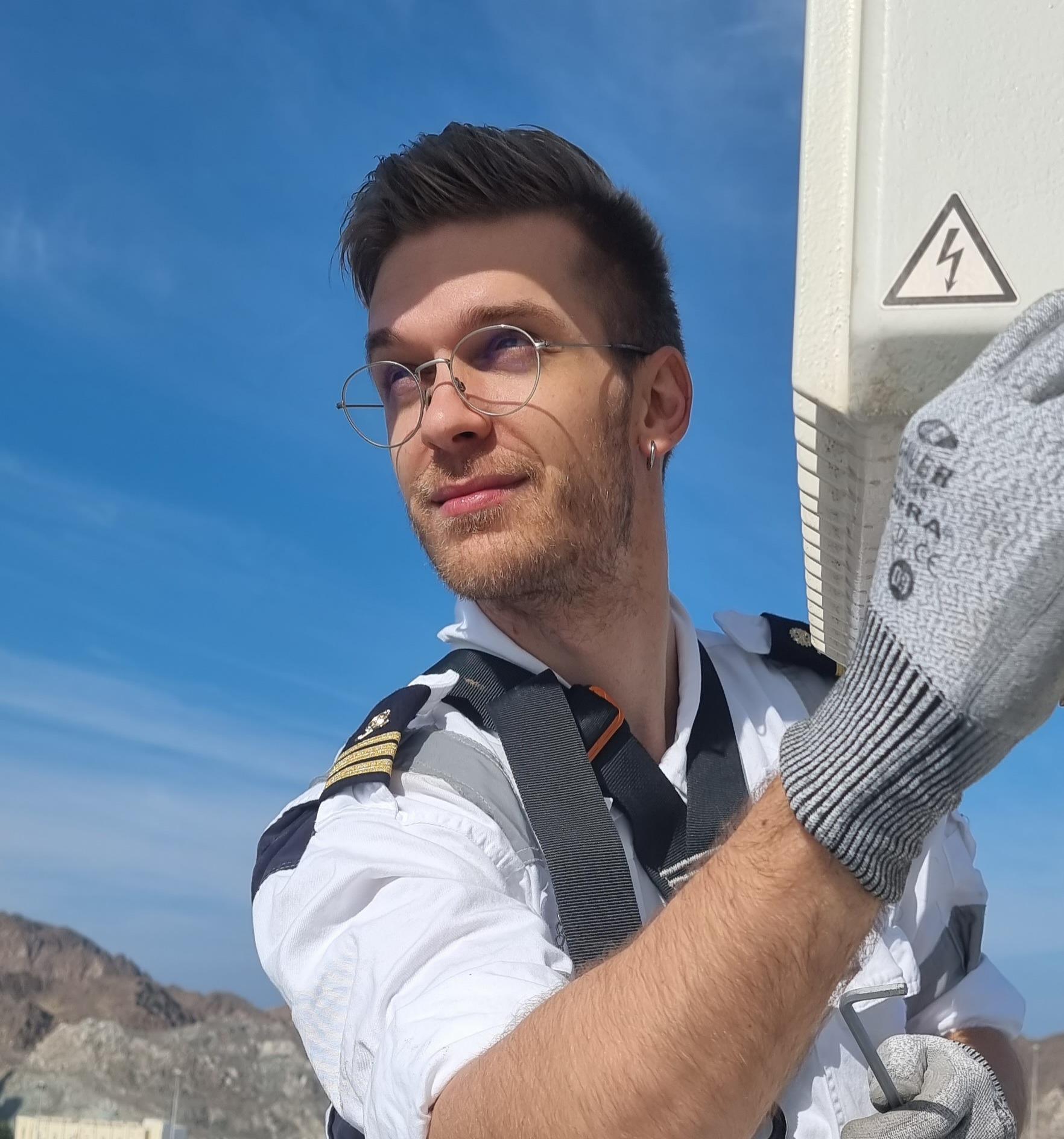 Marko Maletin working on an industrial electrical panel